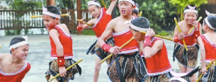 Maonan people beat monkey drum